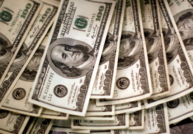 Dollar powers to new two-decade high on Fed outlook, Russia jitters