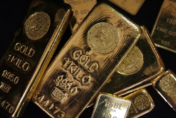 Gold spooked by hawkish Fed outlook despite smaller rate hike