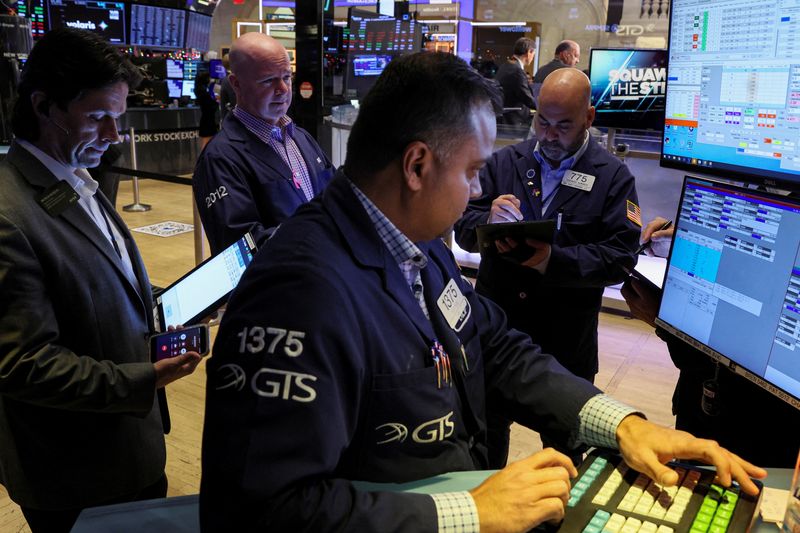 Wall St set to open lower as earnings roll in, chipmakers retreat