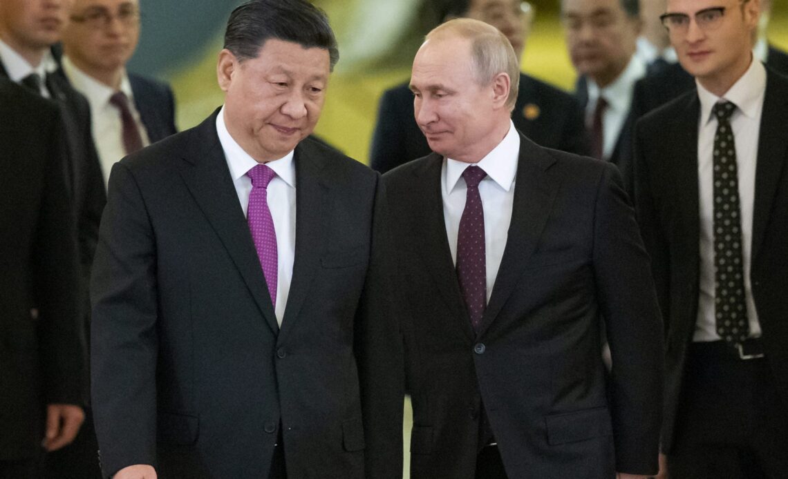 Russia's Putin meets with China's Xi in show of solidarity