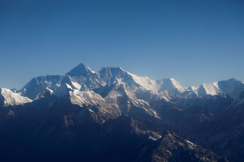 Renowned U.S. mountaineer climbs rare Everest 'triple crown'