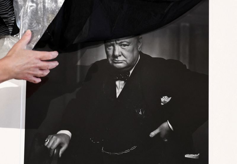 © Reuters. Yousuf Karsh's 'Roaring Lion' portrait of Churchill, stolen in 2022 from Ottawa’s Fairmont Chateau Laurier and recovered in Italy, is unveiled during a ceremony at the Canadian Embassy in Rome, Italy, September 19, 2024. REUTERS/Yara Nardi