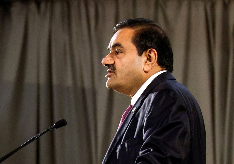 © Reuters. FILE PHOTO: Indian billionaire Gautam Adani speaks during an inauguration ceremony after the Adani Group completed the purchase of Haifa Port earlier in January 2023, in Haifa port, Israel January 31, 2023. REUTERS/Amir Cohen/File Photo