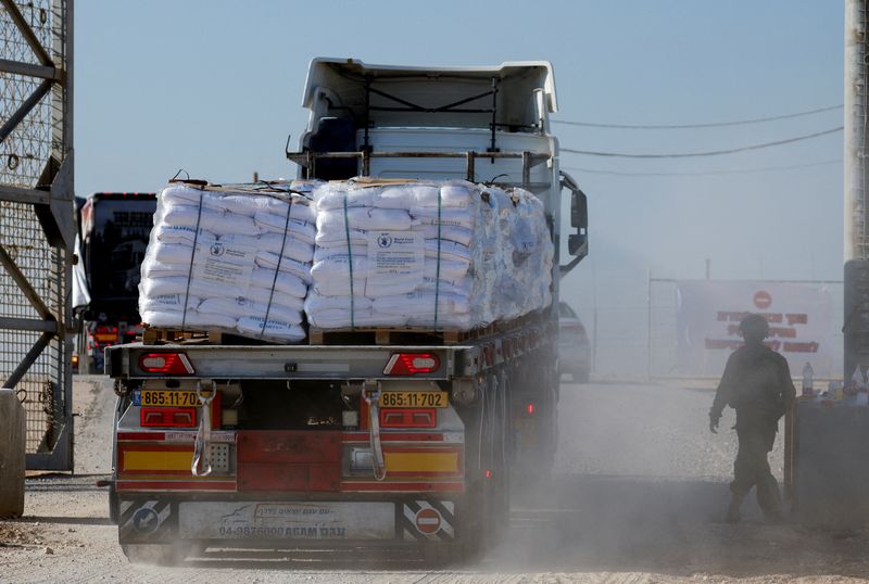 © Reuters. FILE PHOTO: A truck carries humanitarian aid destined for the Gaza Strip, amid the ongoing conflict in Gaza between Israel and Hamas, at the Kerem Shalom crossing in southern Israel, November 11, 2024. REUTERS/Amir Cohen/File Photo