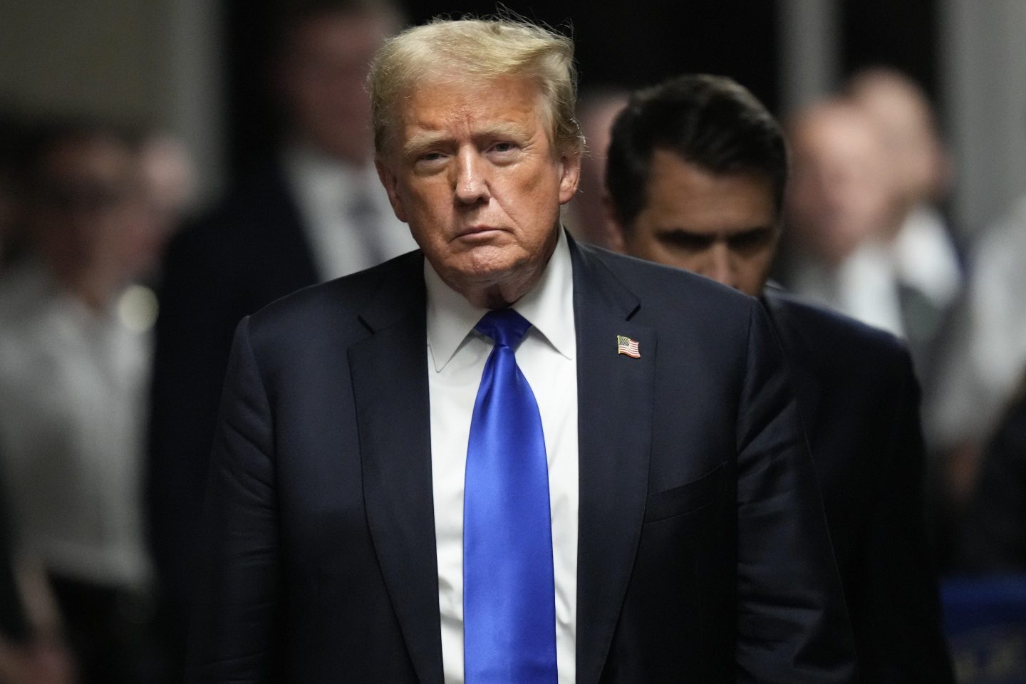 Former President Donald Trump walks to make comments to members of the media after a jury convicted him of felony crimes for falsifying business records in a scheme to illegally influence the 2016 election, at Manhattan Criminal Court, May 30, 2024, in New York.